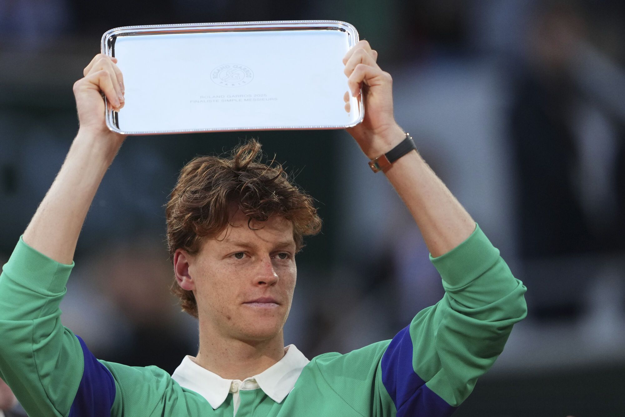 Second placed Italy's Jannik Sinner holds his trophy after the final match of the French Tennis Open against Spain's Carlos Alcaraz at the Roland-Garros stadium in Paris, Sunday, June 8, 2025. (AP Photo/Lindsey Wasson)