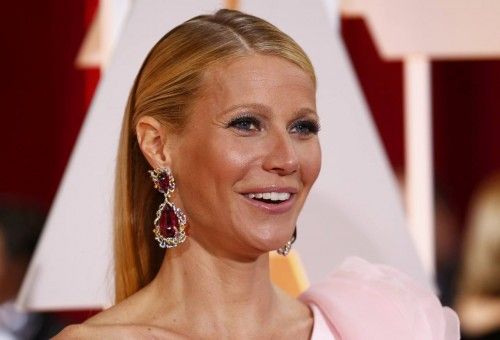 Actress Gwyneth Paltrow, wearing a custom Ralph & Russo pink one sleeve gown with a giant flower on the shoulder, arrives at the 87th Academy Awards in Hollywood, California