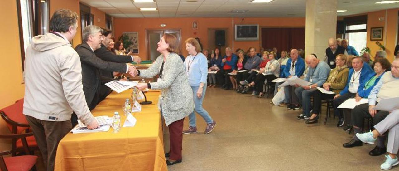 Un acto con emigrantes retornados.