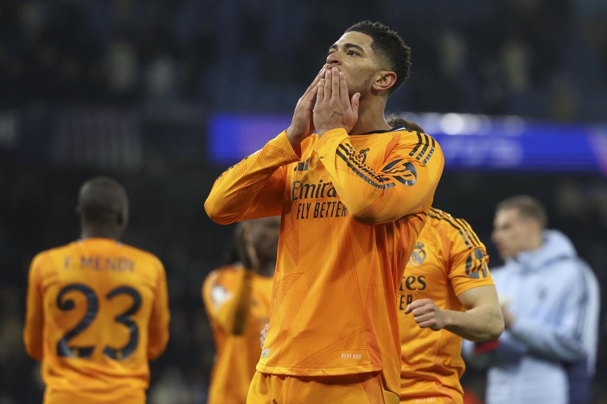 Real Madrids Jude Bellingham greets supporters after winning the Champions League playoff first leg soccer match between Manchester City and Real Madrid at the Etihad Stadium in Manchester, England, Tuesday, Feb. 11, 2025. (AP Photo/Darren Staples)