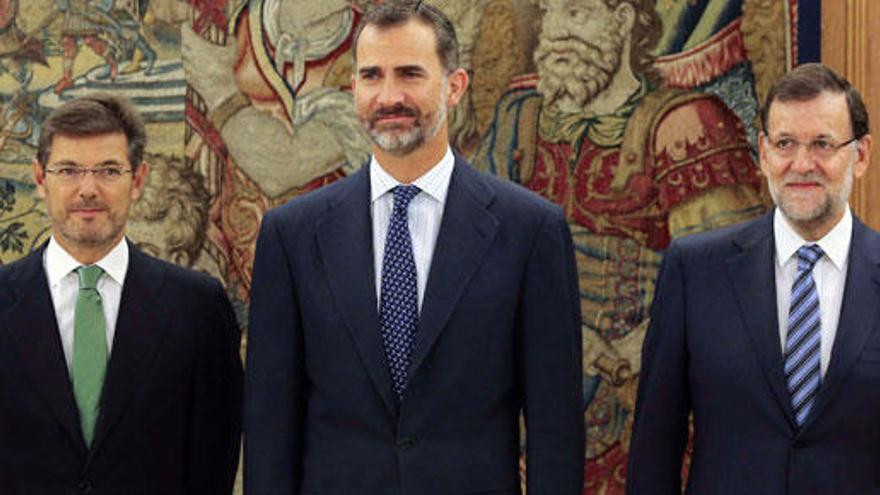 Catalá, junto al Rey y Rajoy.
