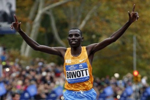 Stanley Biwott of Kenya crosses the finish line to win the men's division of the 2015 New York City Marathon in New York's Central Park