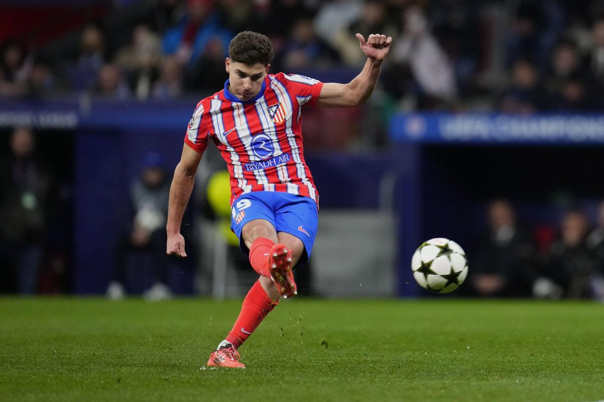 FILE - Atletico Madrid's Julian Alvarez shoots to score the opening goal during the Champions League opening phase soccer match between Atletico Madrid and Slovan Bratislava at Riyadh Air Metropolitano stadium in Madrid, Spain, Wednesday, Dec. 11, 2024. (AP Photo/Manu Fernandez, File). FILE PHOTO