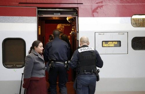 French police officers embark in a Thalys high speed train at Brussels Midi railway in Brussels after security was tightened in Belgium following the fatal attacks in Paris