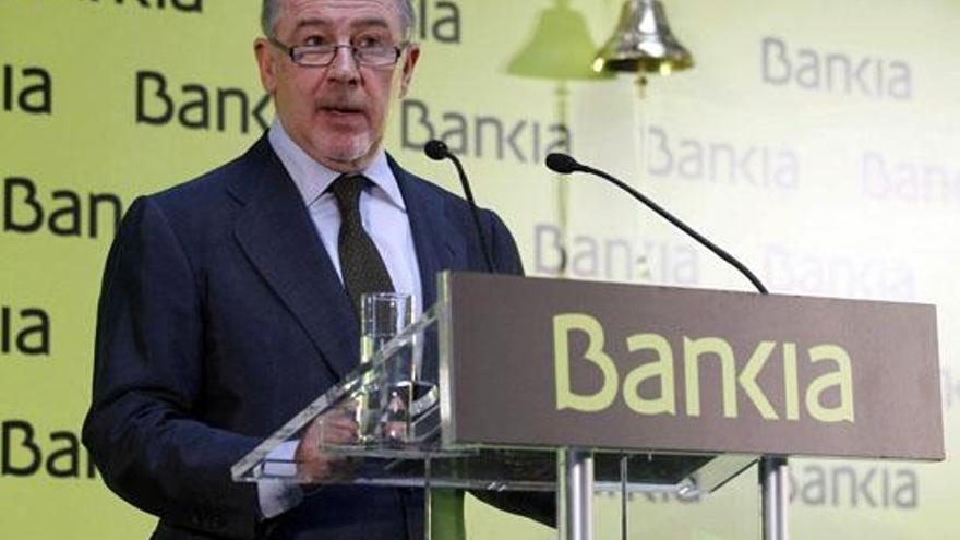 Rodrigo Rato, ayer, tras hacer sonar la campaña que dio inicio a la cotización de Bankia. i EFE