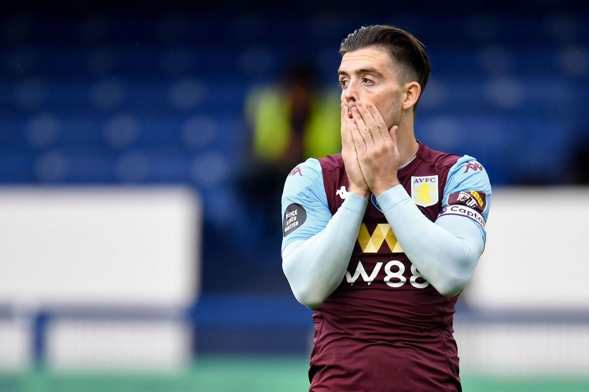 Aston Villa's English midfielder Jack Grealish reacts after missing a shot during the English Premier League football match between Everton and Aston Villa at Goodison Park in Liverpool, north west England on July 16, 2020. (Photo by PETER POWELL / POOL / AFP) / RESTRICTED TO EDITORIAL USE. No use with unauthorized audio, video, data, fixture lists, club/league logos or 'live' services. Online in-match use limited to 120 images. An additional 40 images may be used in extra time. No video emulation. Social media in-match use limited to 120 images. An additional 40 images may be used in extra time. No use in betting publications, games or single club/league/player publications. /. HORIZONTAL