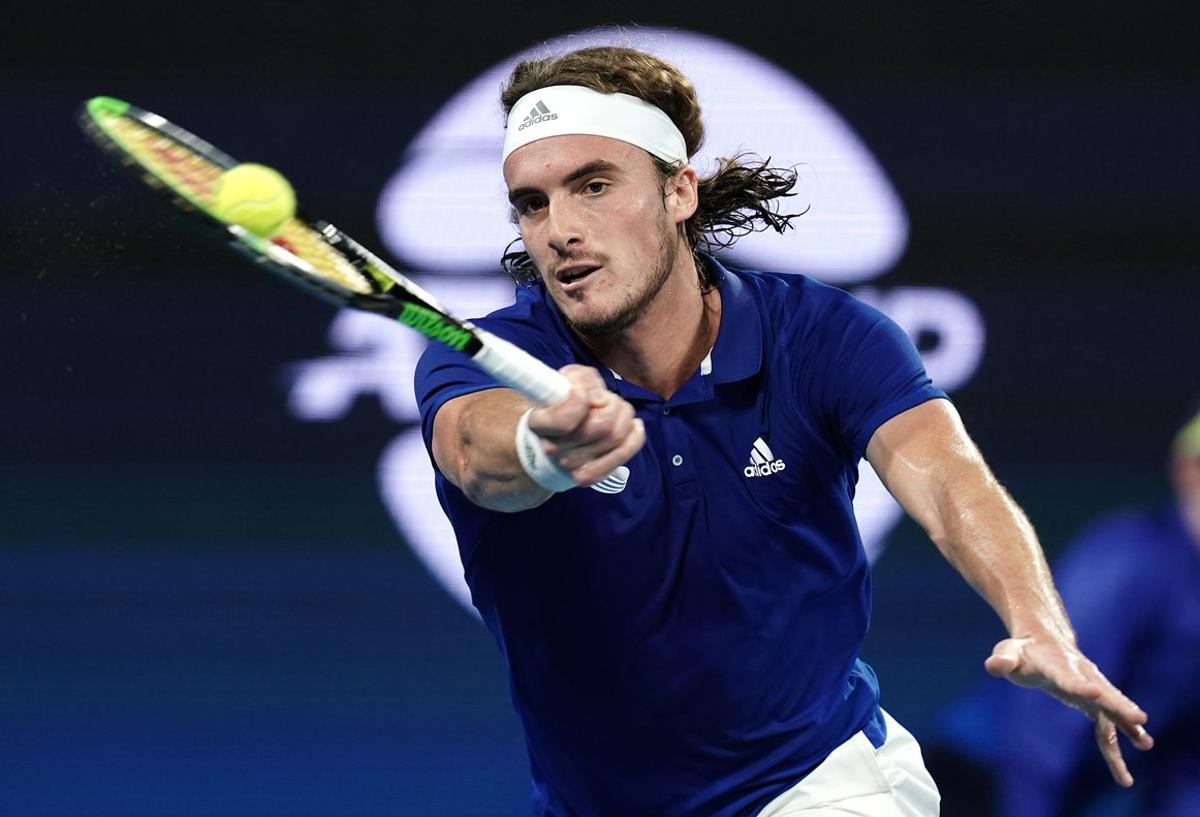 Stefanos Tsitsipas of Greece returns during his singles match against Nick Kyrgios of Australia  on day 5 of the ATP Cup tennis tournament at Pat Rafter Arena in Brisbane, Tuesday, January 7, 2020. (AAP Image/Dave Hunt) NO ARCHIVING, EDITORIAL USE ONLY