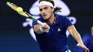 Stefanos Tsitsipas of Greece returns during his singles match against Nick Kyrgios of Australia  on day 5 of the ATP Cup tennis tournament at Pat Rafter Arena in Brisbane, Tuesday, January 7, 2020. (AAP Image/Dave Hunt) NO ARCHIVING, EDITORIAL USE ONLY