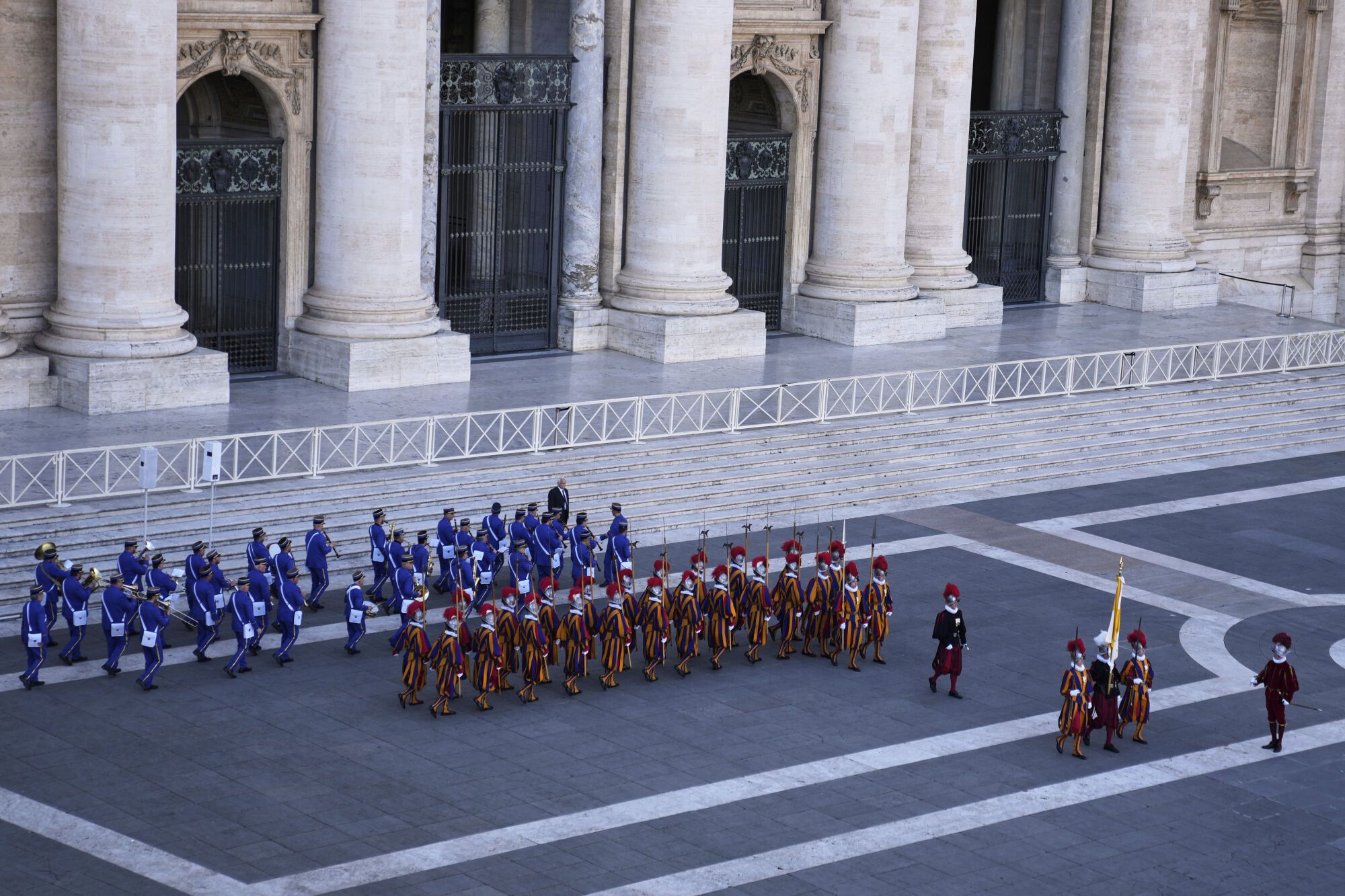Swis guards stand outside St. Peter's Basicilca after the white smoke billowed from the chimney of the Sistine Chapel where 133 cardinals gathered on the second day of the conclave to elect a successor to late Pope Francis, at the Vatican, Thursday, May 8, 2025 (AP Photo/Markus Schreiber)
