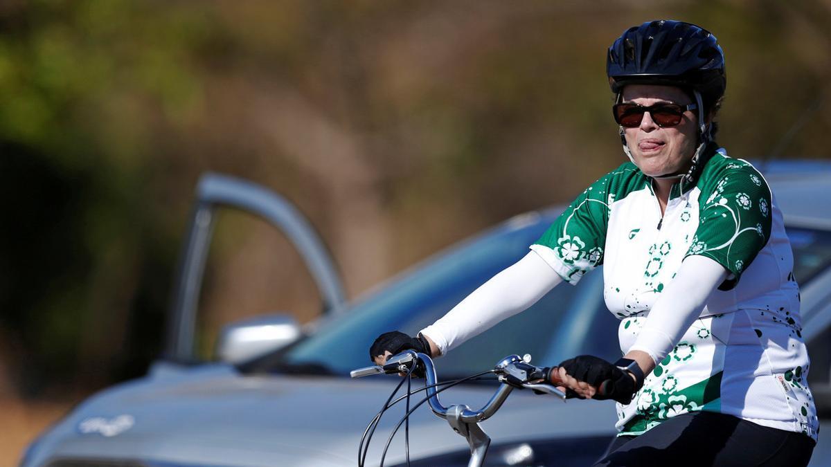 Brazil's suspended President Dilma Rousseff rides her bicycle near the Alvorada Palace in Brasilia