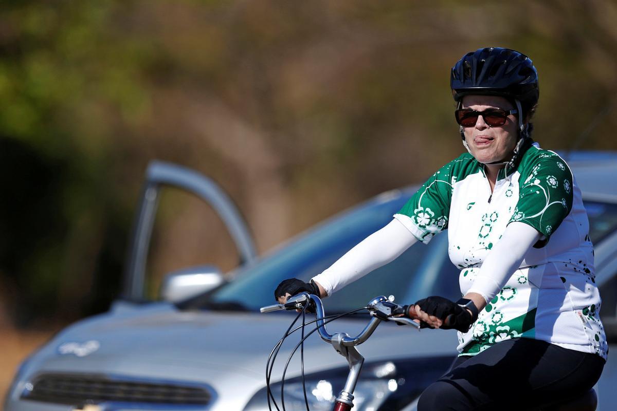 Brazil’s suspended President Dilma Rousseff rides her bicycle near the Alvorada Palace a day before she will testify at the Brazilan Senate, in Brasilia, Brazil August 28, 2016. REUTERS/Ueslei Marcelino