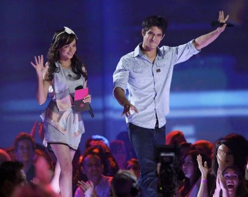 Presenters Ashley Rickards and Tyler Posey take the stage at the 2013 MTV Movie Awards in Culver City