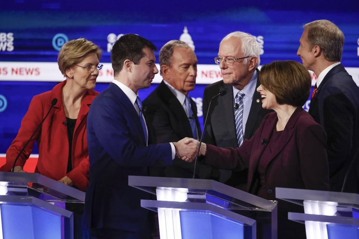 From left, Democratic presidential candidates, Sen. Elizabeth Warren, D-Mass., former South Bend Mayor Pete Buttigieg, former New York City Mayor Mike Bloomberg, Sen. Bernie Sanders, I-Vt., Sen. Amy Klobuchar, D-Minn., and businessman Tom Steyer, greet on another on stage at the end of the Democratic presidential primary debate at the Gaillard Center, Tuesday, Feb. 25, 2020, in Charleston, S.C., co-hosted by CBS News and the Congressional Black Caucus Institute. (AP Photo/Patrick Semansky)