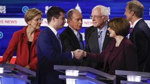 From left, Democratic presidential candidates, Sen. Elizabeth Warren, D-Mass., former South Bend Mayor Pete Buttigieg, former New York City Mayor Mike Bloomberg, Sen. Bernie Sanders, I-Vt., Sen. Amy Klobuchar, D-Minn., and businessman Tom Steyer, greet on another on stage at the end of the Democratic presidential primary debate at the Gaillard Center, Tuesday, Feb. 25, 2020, in Charleston, S.C., co-hosted by CBS News and the Congressional Black Caucus Institute. (AP Photo/Patrick Semansky)