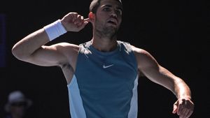 Carlos Alcaraz of Spain reacts after winning a point against Nuno Borges of Portugal during their third round match at the Australian Open tennis championship in Melbourne, Australia, Friday, Jan. 17, 2025. (AP Photo/Asanka Brendon Ratnayake). EDITORIAL USE ONLY/ONLY ITALY AND SPAIN