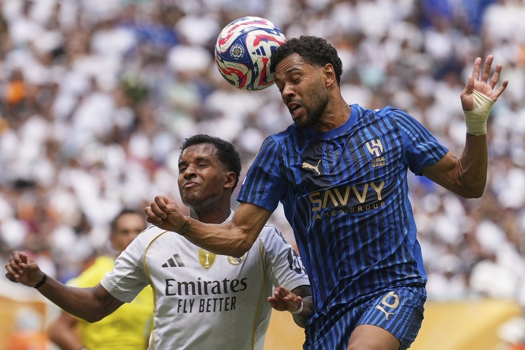 Al-Hilal's Marcos Leonardo and Real Madrid's Eduardo Camavinga go to head the ball during the Club World Cup group H soccer match between Real Madrid and Al Hilal in Miami Gardens, Fla., Wednesday, June 18, 2025. (AP Photo/Rebecca Blackwell). EDITORIAL USE ONLY/ONLY ITALY AND SPAIN