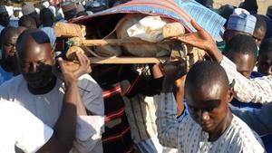 mbenach40965197 mourners carry for burial the victims of suicide bomb attack171121113123