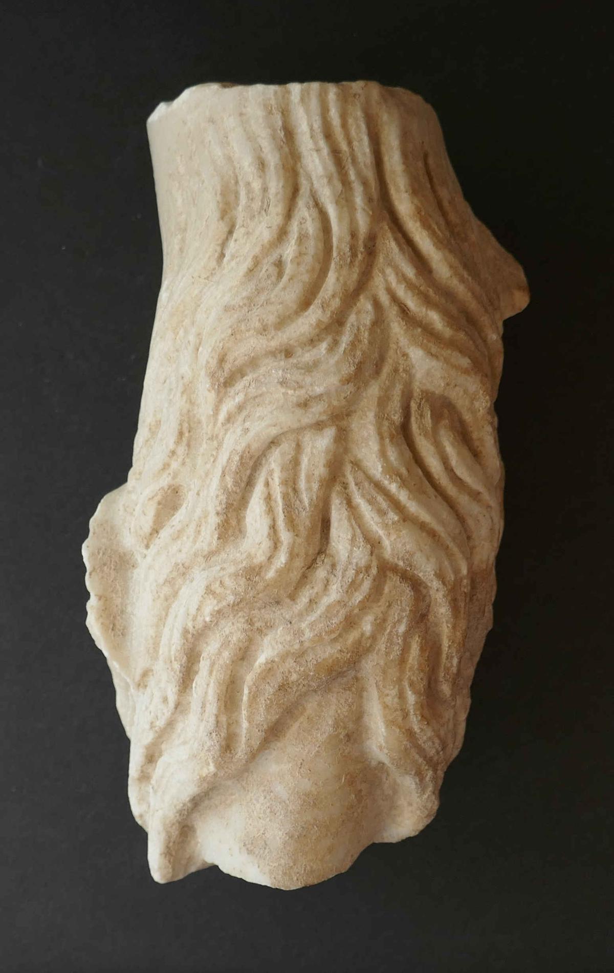 Fragmento de una escultura de un sátiro, recuperada por la Guardia Civil en Baena.