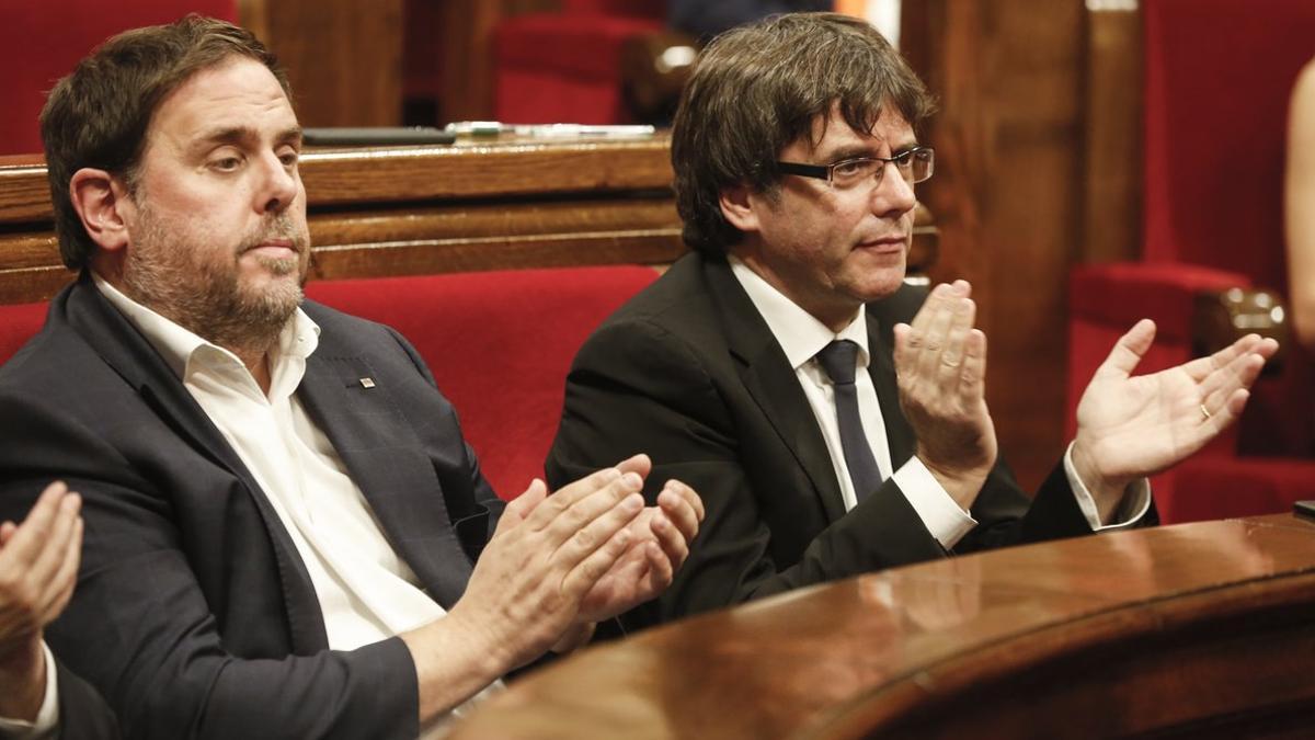 Oriol Junqueras y Carles Puigdemont, en el Parlament