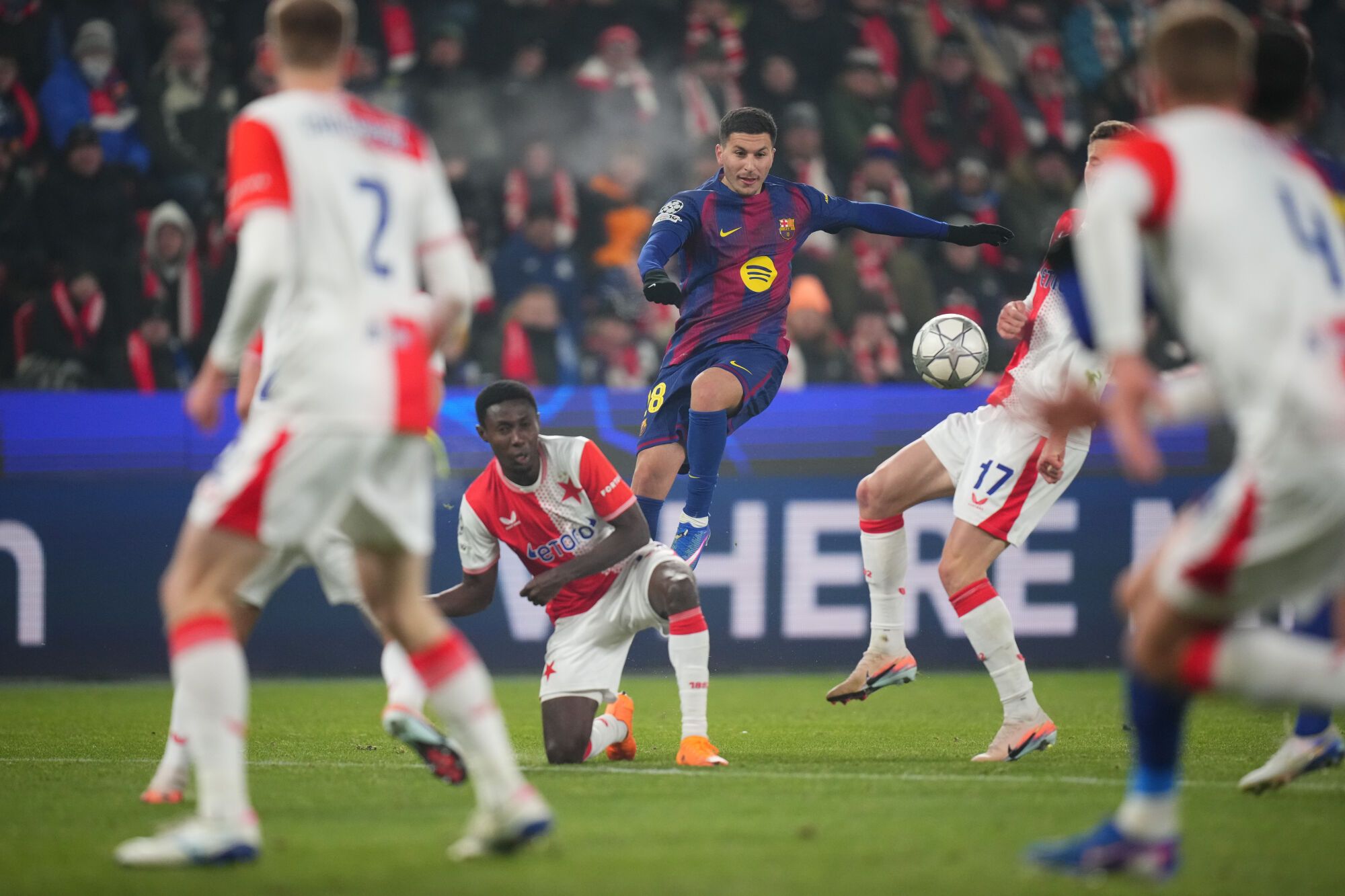 Barcelona's Roony Bardghji, center, attempts a shot at goal during the Champions League opening phase soccer match between Slavia Prague and Barcelona in Prague, Czech Republic, Wednesday, Jan. 21, 2026. (AP Photo/Petr David Josek)