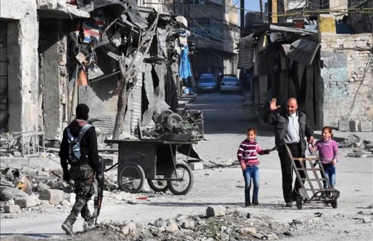 undefined36559030 topshot   a man waves to a member of the syrian pro governme161209101814
