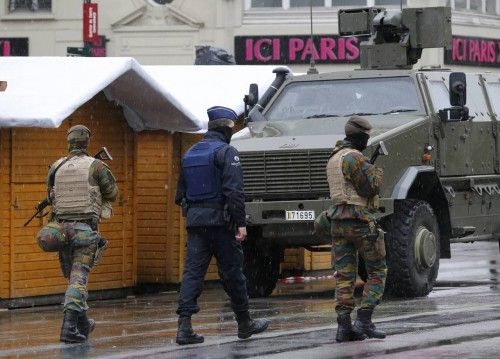 Belgian soldiers patrol in central Brussels after security was tightened in Belgium following the fatal attacks in Paris