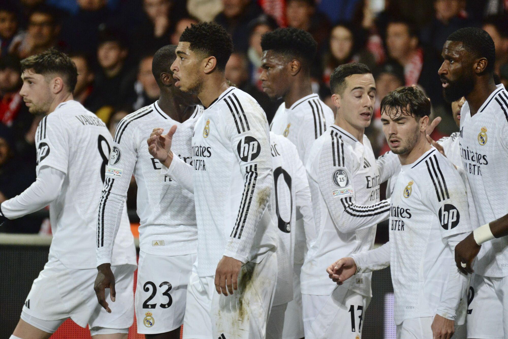 Real Madrid's Rodrygo, covered by his teammates, celebrates after scoring his side's opening goal during the Champions League opening phase soccer match between Brest and Real Madrid at Roudourou stadium in Guingamp, France, Wednesday, Jan. 29, 2025. (AP Photo/Mathieu Pattier). EDITORIAL USE ONLY / ONLY ITALY AND SPAIN