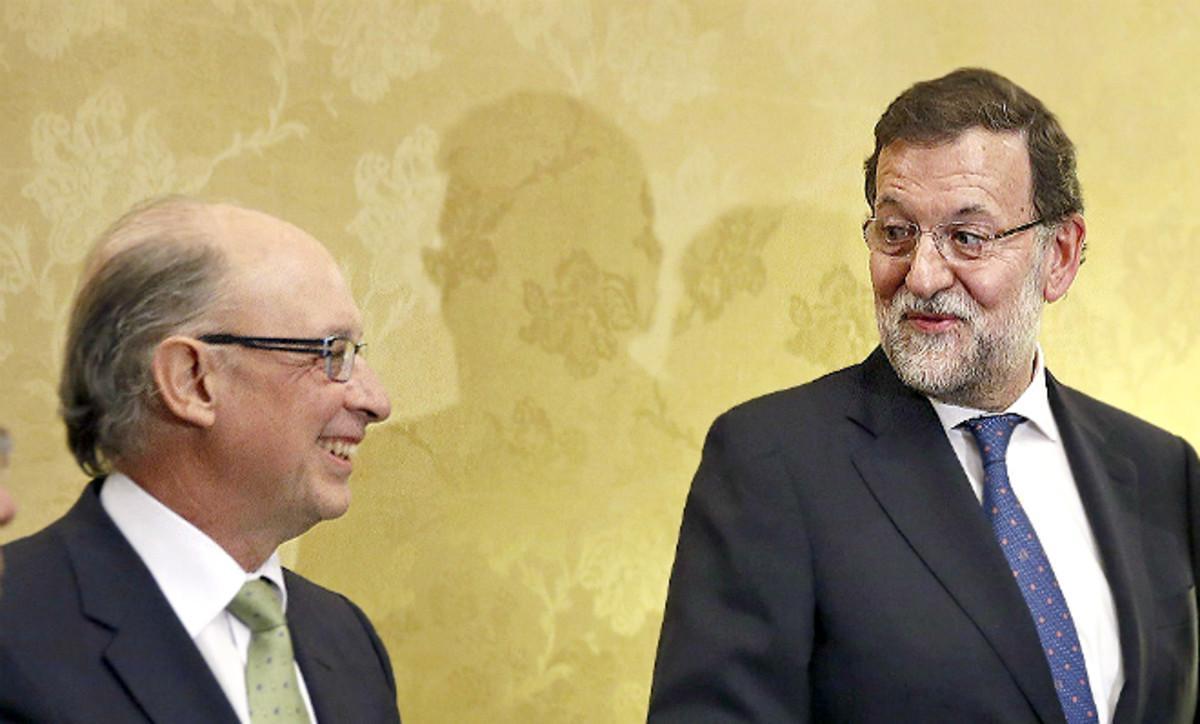 Cristóbal Montoro y Mariano Rajoy. 