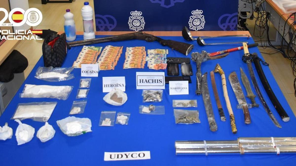 Drugs, money and weapons seized during the operation.