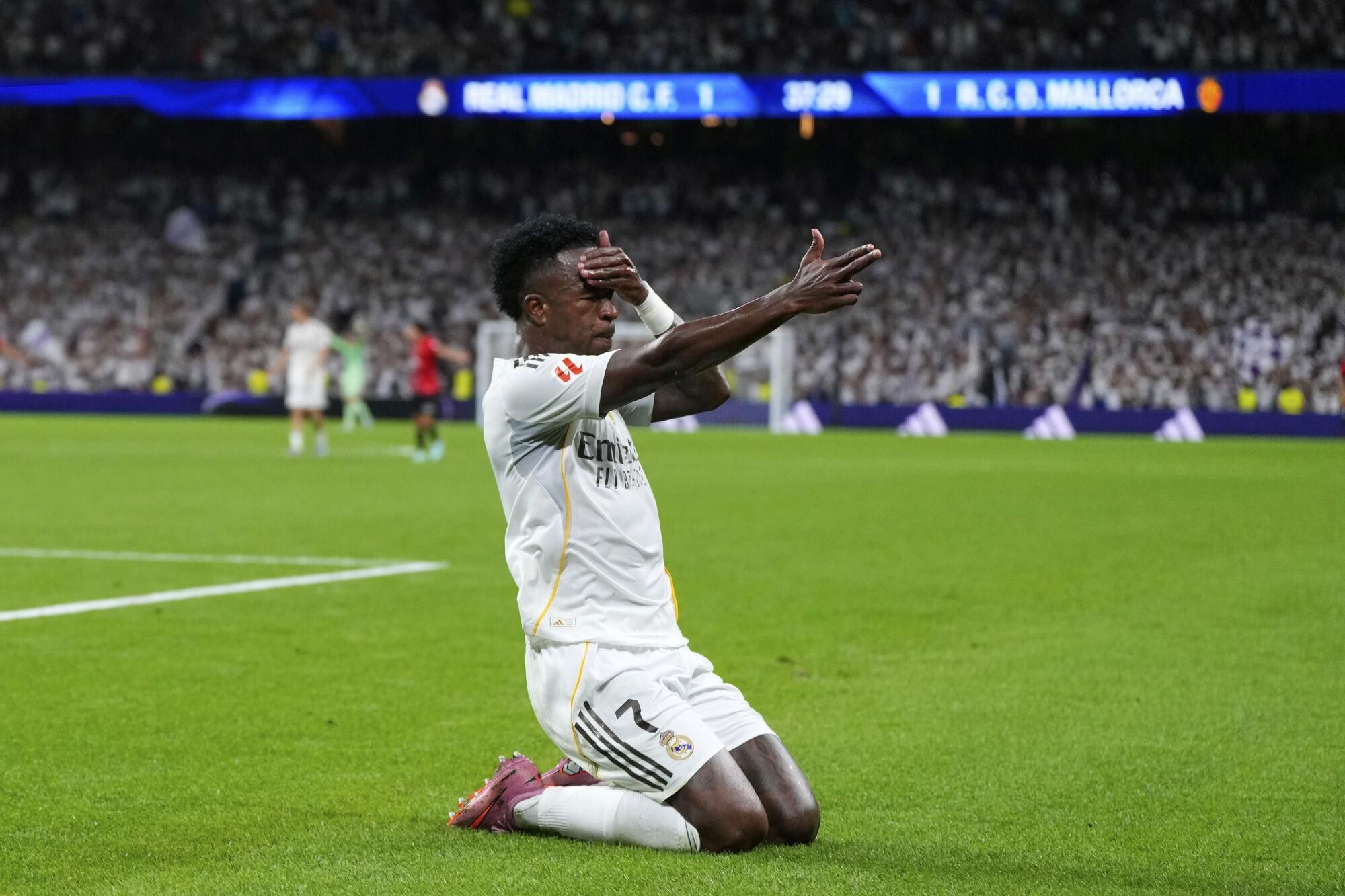 Real Madrid's Vinicius Junior celebrates scoring his side's second goal during the Spanish La Liga soccer match between Real Madrid and Mallorca in Madrid, Saturday, Aug. 30, 2025. (AP Photo/Manu Fernandez)
