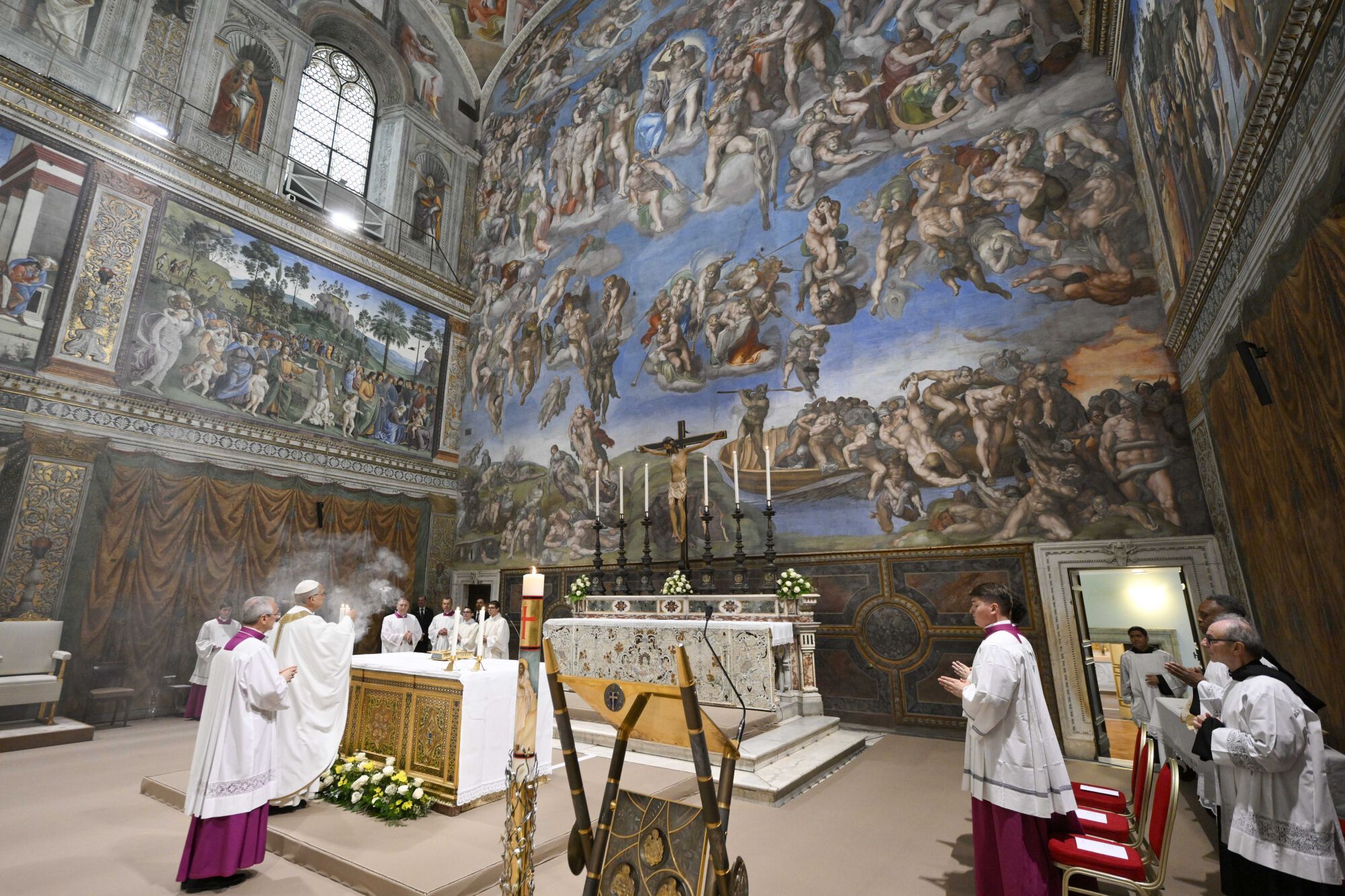 Newly elected Pope Leo XIV, second from left, concelebrates Mass with the College of Cardinals inside the Sistine Chapel at the Vatican the day after his election as 267th pontiff of the Roman Catholic Church, Friday, May 9, 2025. (Vatican Media via AP). AP PROVIDES ACCESS TO THIS GOVERNMENT PRODUCED PHOTO SOLELY TO ILLUSTRATE NEWS REPORTING OR COMMENTARY ON FACTS DEPICTED IN IMAGE; MUST BE USED WITHIN 14 DAYS FROM TRANSMISSION; NO ARCHIVING; NO LICENSING; MANDATORY CREDIT