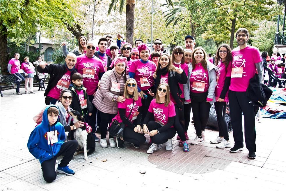 Las imágenes de la marcha y la carrera rosa de Cáceres