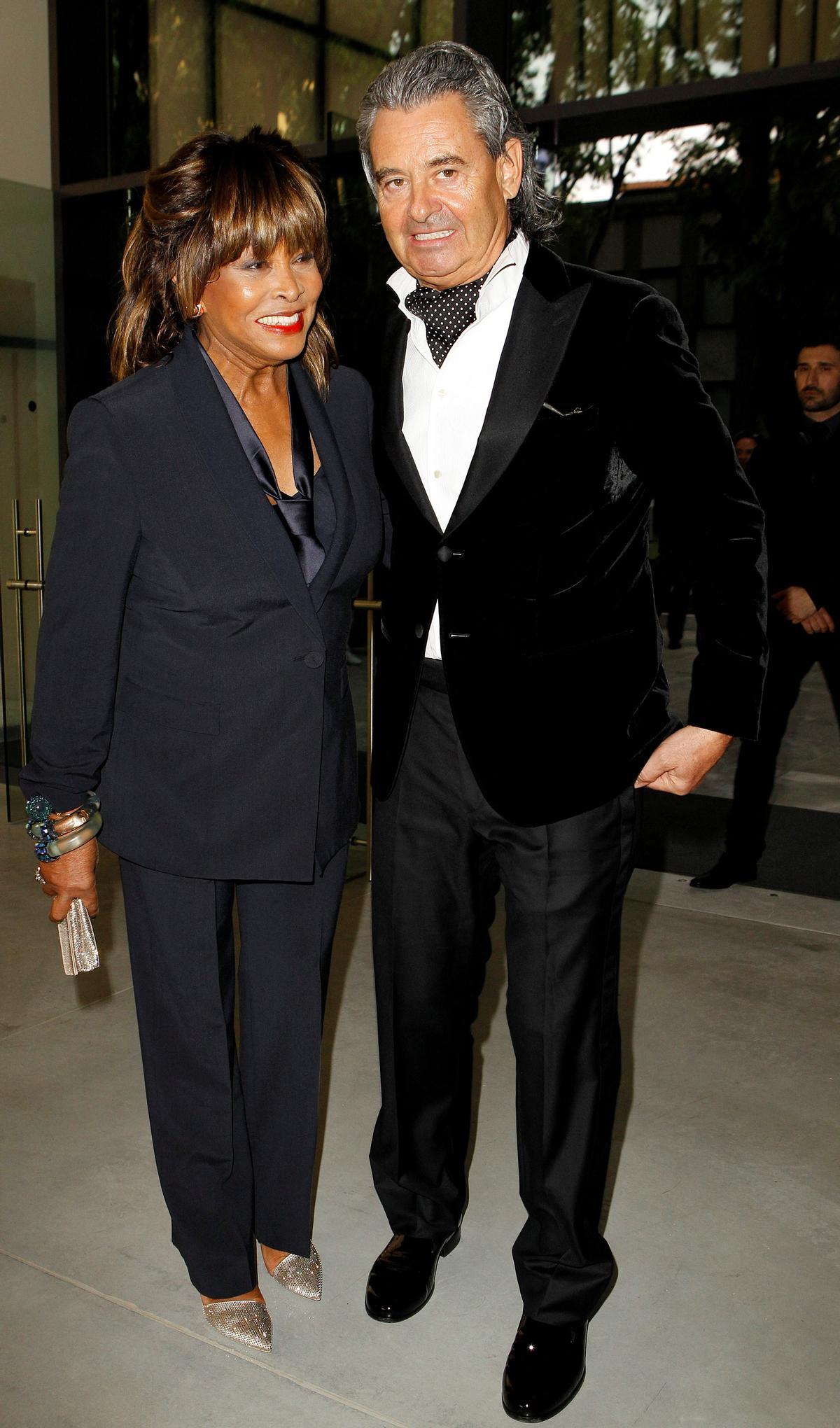 FILE PHOTO: Tina Turner pose with husband Erwin Bach before Giorgio Armanis fashion show to celebrate 40th anniversary of career and to mark opening of the Expo 2015 in Milan