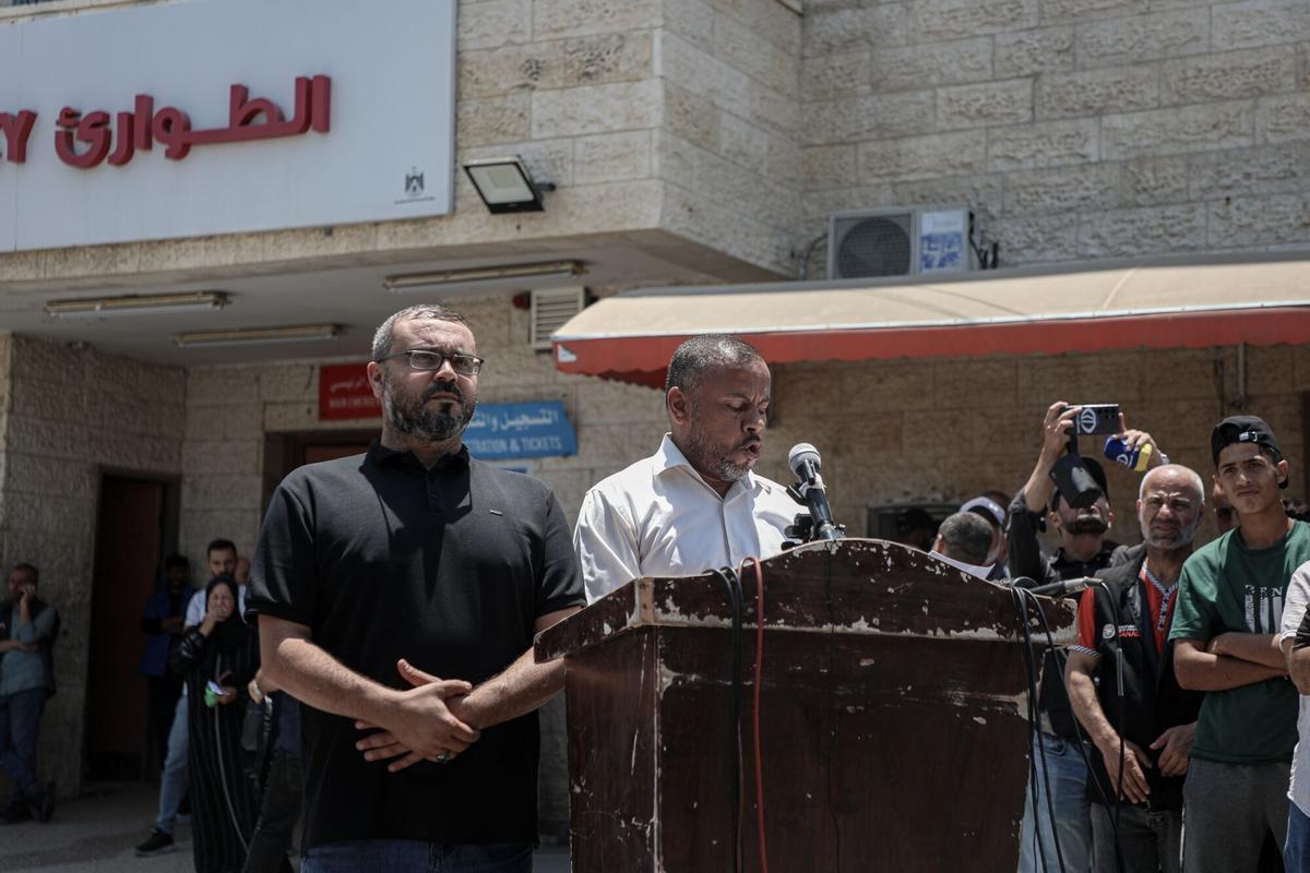 Ismail Al-Thawabta, head of Hamas's government media office, right, and Hazem Qassem, Hamas spokesperson, deliver a statement at a news conference at the Al-Aqsa Hospital in Deir al-Balah, central Gaza, on Monday, July 6, 2026. Gaza needs an estimated $71.4 billion over the next decade to recover from two years of war that devastated most of the Palestinian territory, a study by the European Union, United Nations and World Bank has shown. Photographer: Ahmad Salem/Bloomberg
