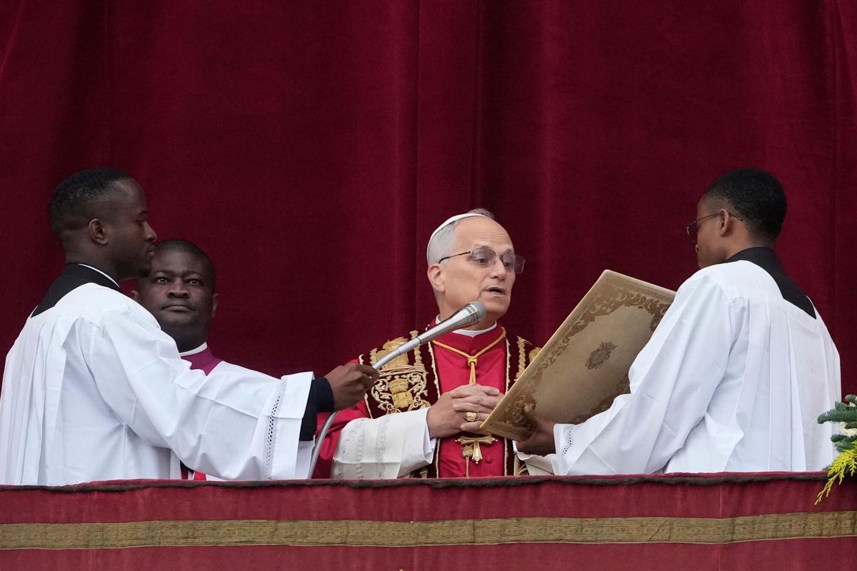 Pope Leo XIV delivers the Urbi et Orbi (Latin for 'to the city and to the world' ) Christmas' day blessing from the main balcony of St. Peter's Basilica at the Vatican, Thursday, Dec. 25, 2025. (AP Photo/Gregorio Borgia)