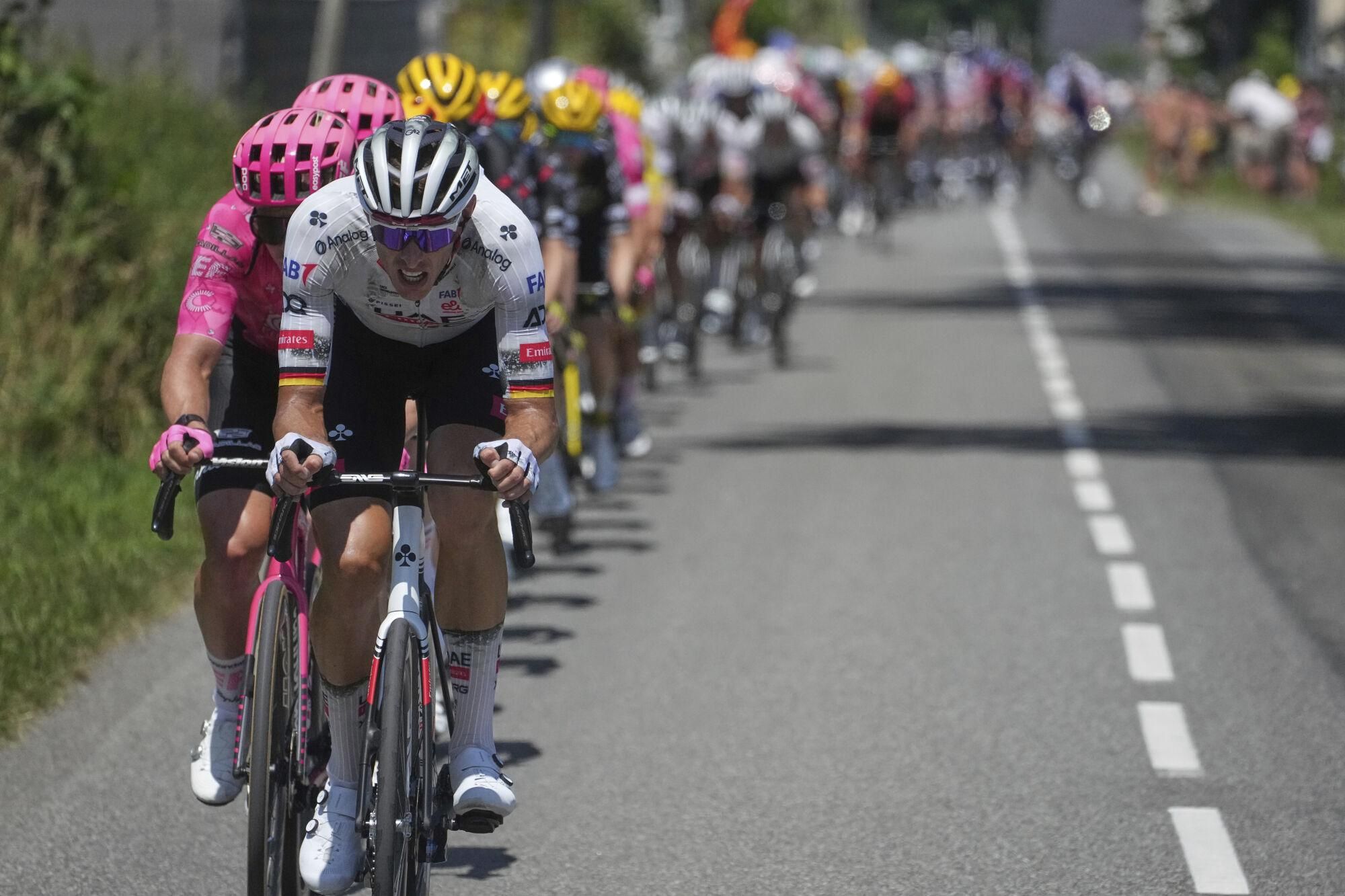 Germany's Nils Politt leads the chase of the pack after the breakaway during the twelfth stage of the Tour de France cycling race over 180.6 kilometers (112.2 miles) with start in Auch and finish in Hautacam, France, Thursday, July 17, 2025. (AP Photo/Thibault Camus)