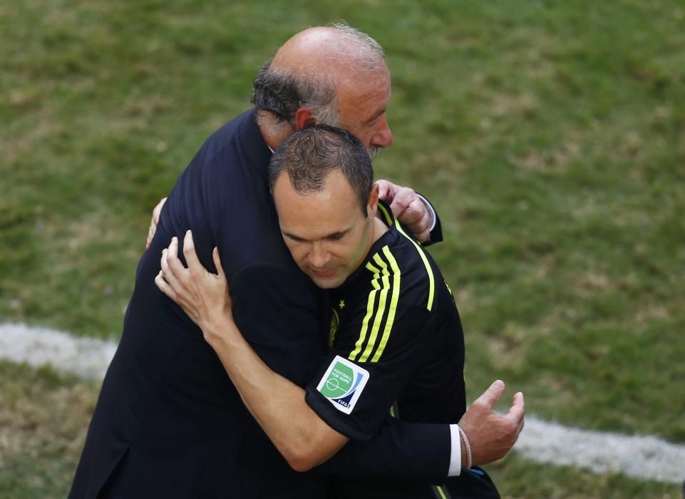 Spain's coach Vicente Del Bosque embraces Andres ...
