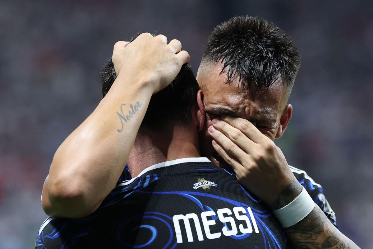 Argentina's forward #22 Lautaro Martinez celebrates with Argentina's forward #10 Lionel Messi scoring his team's second goal during the 2026 World Cup football tournament semi-final match between England and Argentina at the Atlanta Stadium in Atlanta on July 15, 2026.  (Photo by Thomas COEX / AFP)