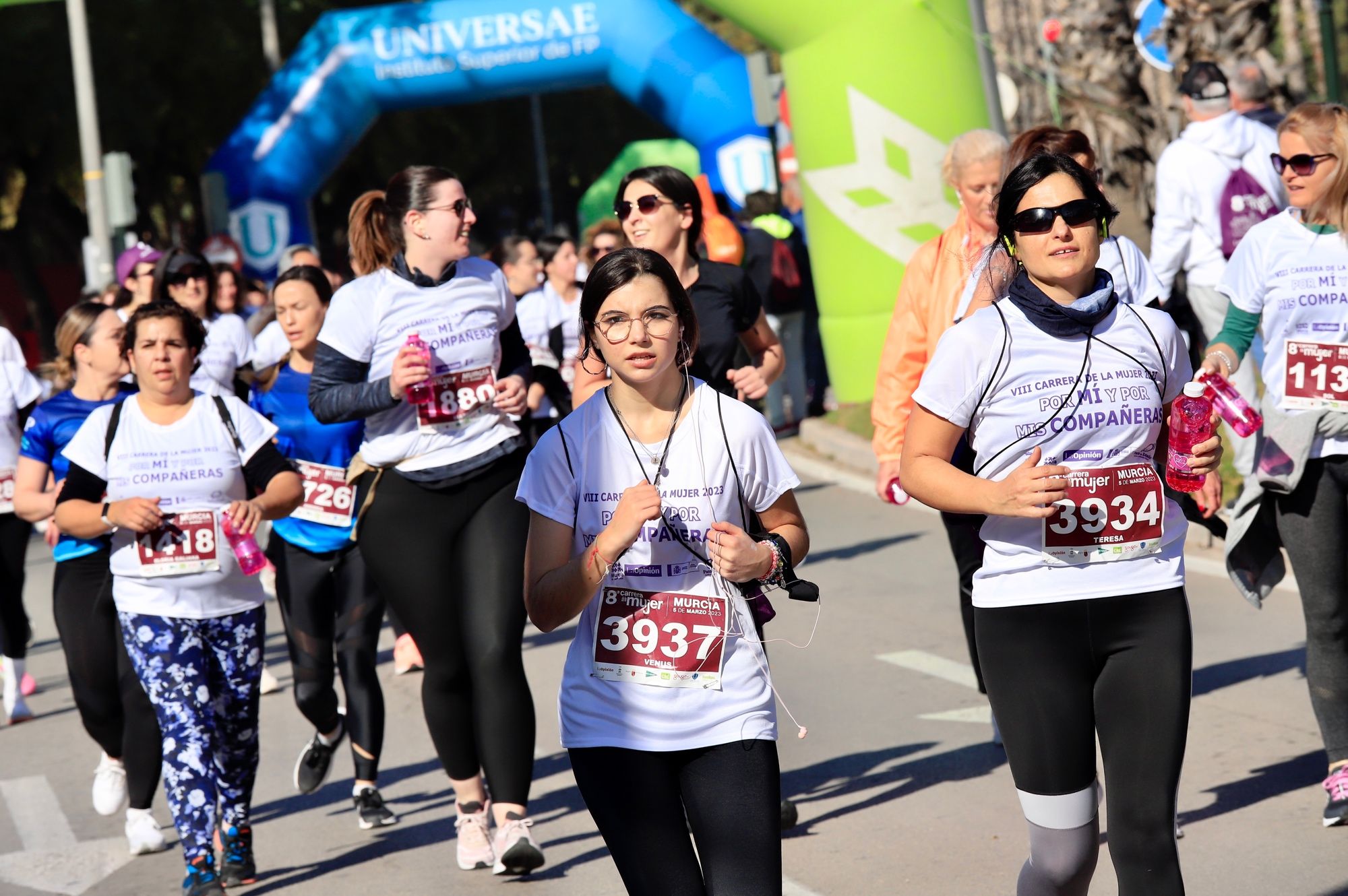 La salida y el recorrido de la Carrera de la Mujer 'inmortalizados' en imágenes