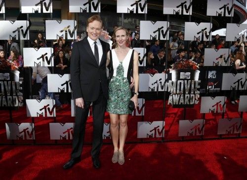 Conan O'Brien and Liza Powell arrive at the 2014 MTV Movie Awards in Los Angeles