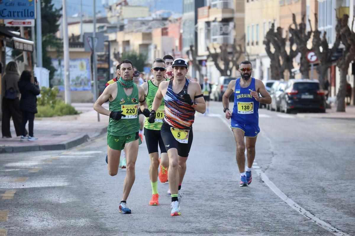 Las imágenes de la carrera popular solidaria en el barrio de El Progreso