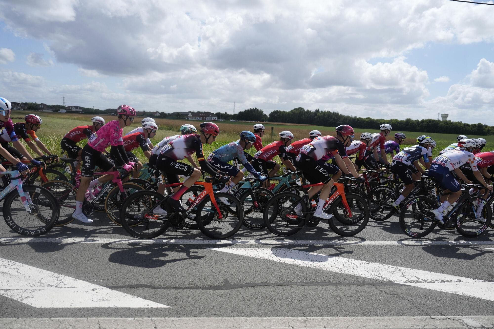 The pack rides during the third stage of the Tour de France cycling race over 178.3 kilometers (110.8 miles) with start in Valenciennes and finish in Dunkerque, France, Monday, July 7, 2025. (AP Photo/Mosa'ab Elshamy) Associated Press / LaPresse Only italy and spain. EDITORIAL USE ONLY/ONLY ITALY AND SPAIN