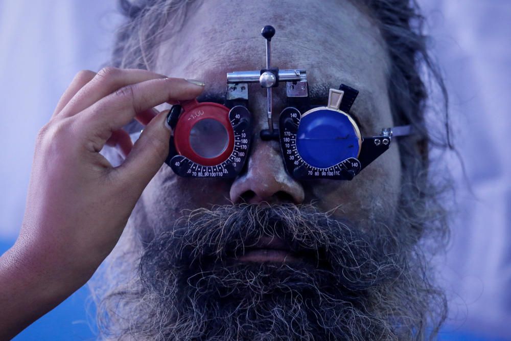 A Sadhu or a Hindu holy man gets his eyes tested ...