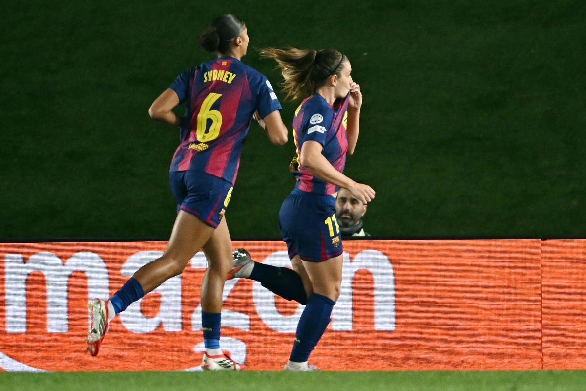 Barcelona's Spanish midfielder #11 Alexia Putellas (R) celebrates scoring her team's sixth goal during the UEFA Women's Champions League quarter final first leg football match between Real Madrid CF and FC Barcelona at the Alfredo Di Stefano stadium in Madrid on March 25, 2026. (Photo by Javier SORIANO / AFP)