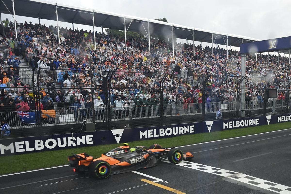 McLaren driver Lando Norris of Britain crosses the finish line to win the Australian Formula One Grand Prix at Albert Park, in Melbourne, Australia, Sunday, March 16, 2025. (Tracey Nearmy/Pool Photo via AP). POOL PHOTO
