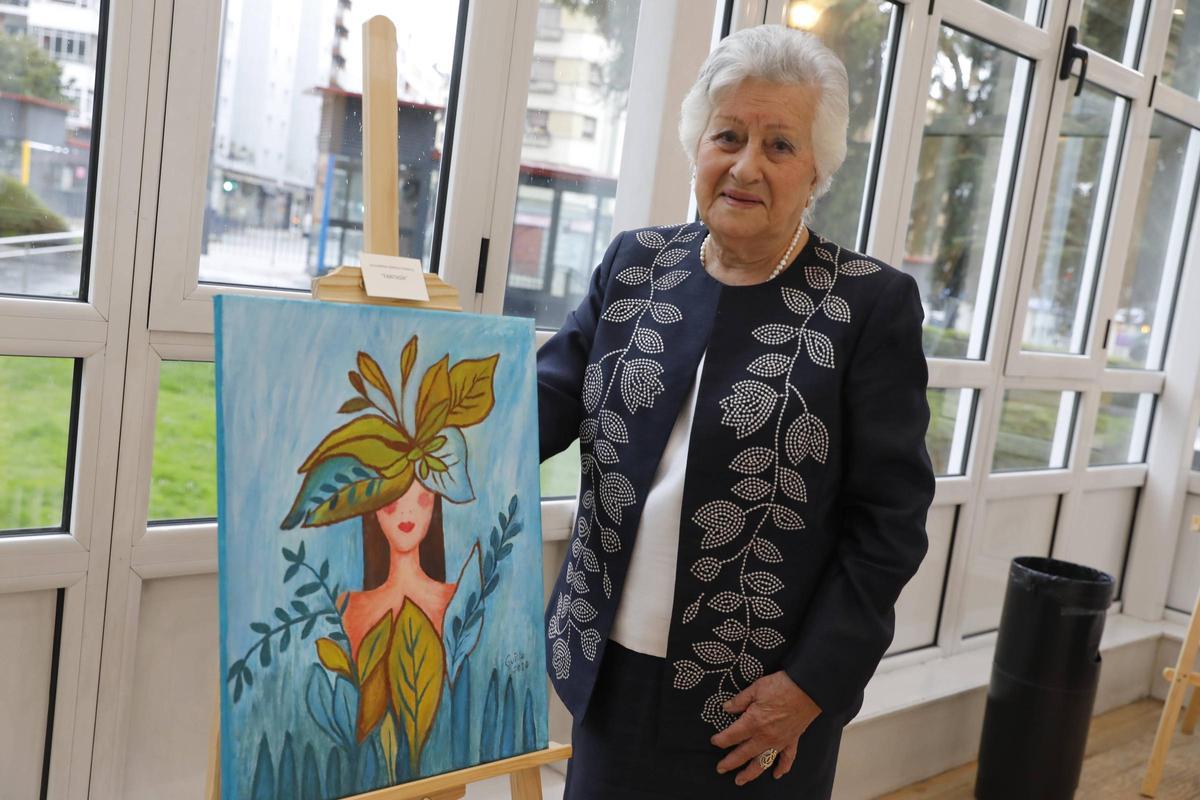 Guillermina González, con su cuadro.