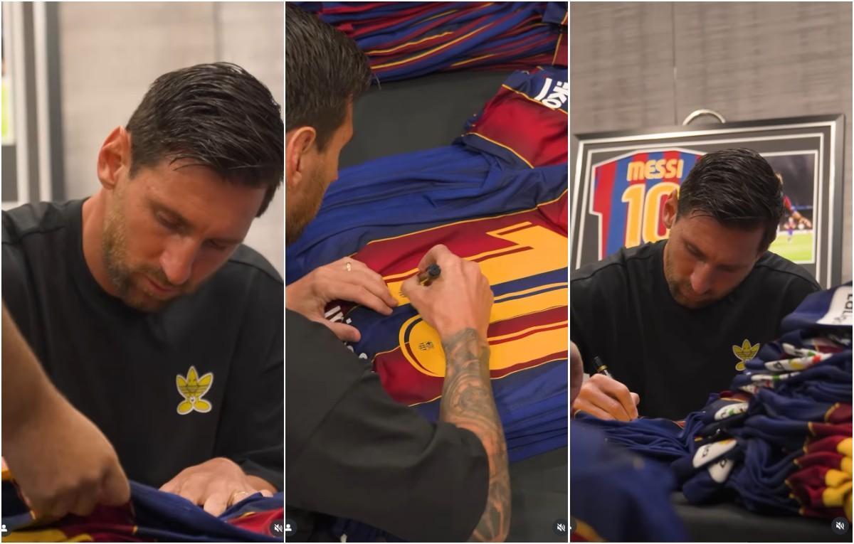 Messi firmando las camisetas