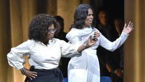 lmmarco45888821 michelle obama  right  is greeted by oprah winfrey to discus190328132511
