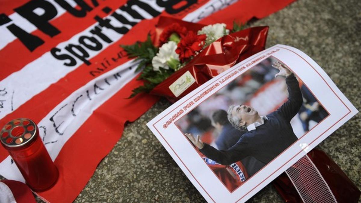 A photo of Sporting Gijon coach Preciado is seen as supporters gather outside El Molinon stadium to to pay their last respects to him in Gijon