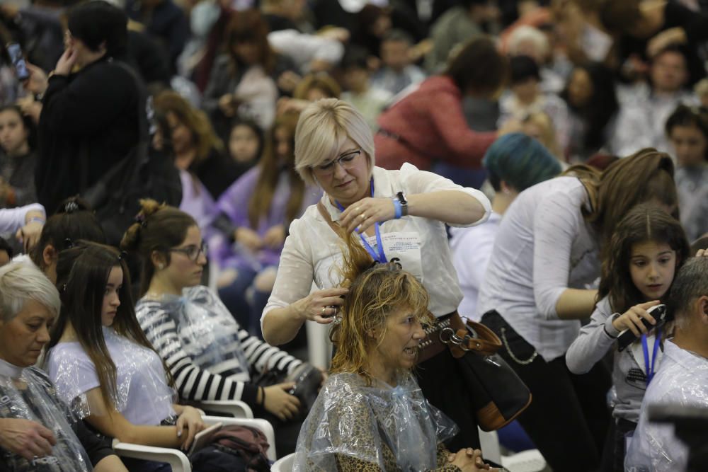 Corte de pelo simultáneo en València